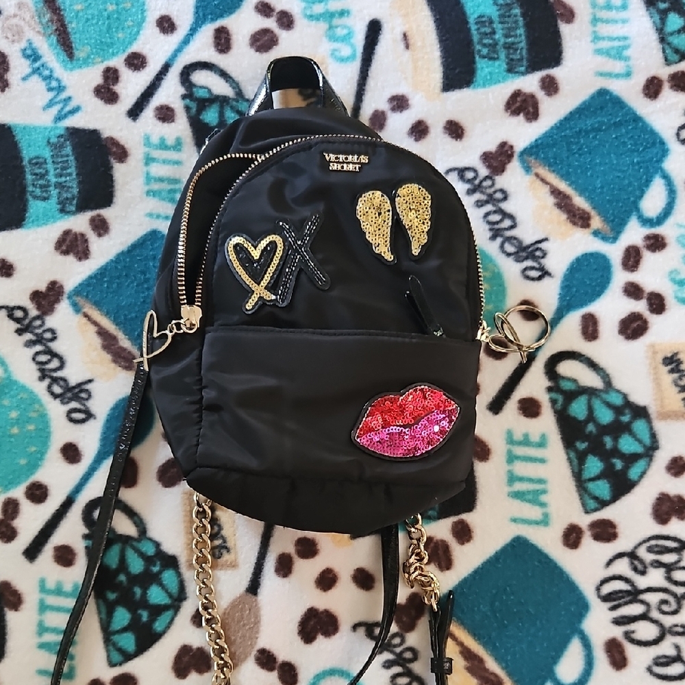 Victoria's Secret Black Backpack with Gold and Pink Embellishments